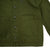 General detail shot of Topo Designs Women's Dirt Jacket in Olive green showing front pockets and buttons.