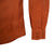 General detail shot of Topo Designs Men's Dirt Shirt in Brick orange showing buttons on sleeve cuff.