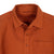 General detail shot of Topo Designs Women's Dirt Shirt in Brick orange showing collar, buttons, and chest pocket.