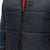 General front detail shot of Topo Designs Men's Mountain Puffer recycled insulated Vest in "Black" showing double zipper.