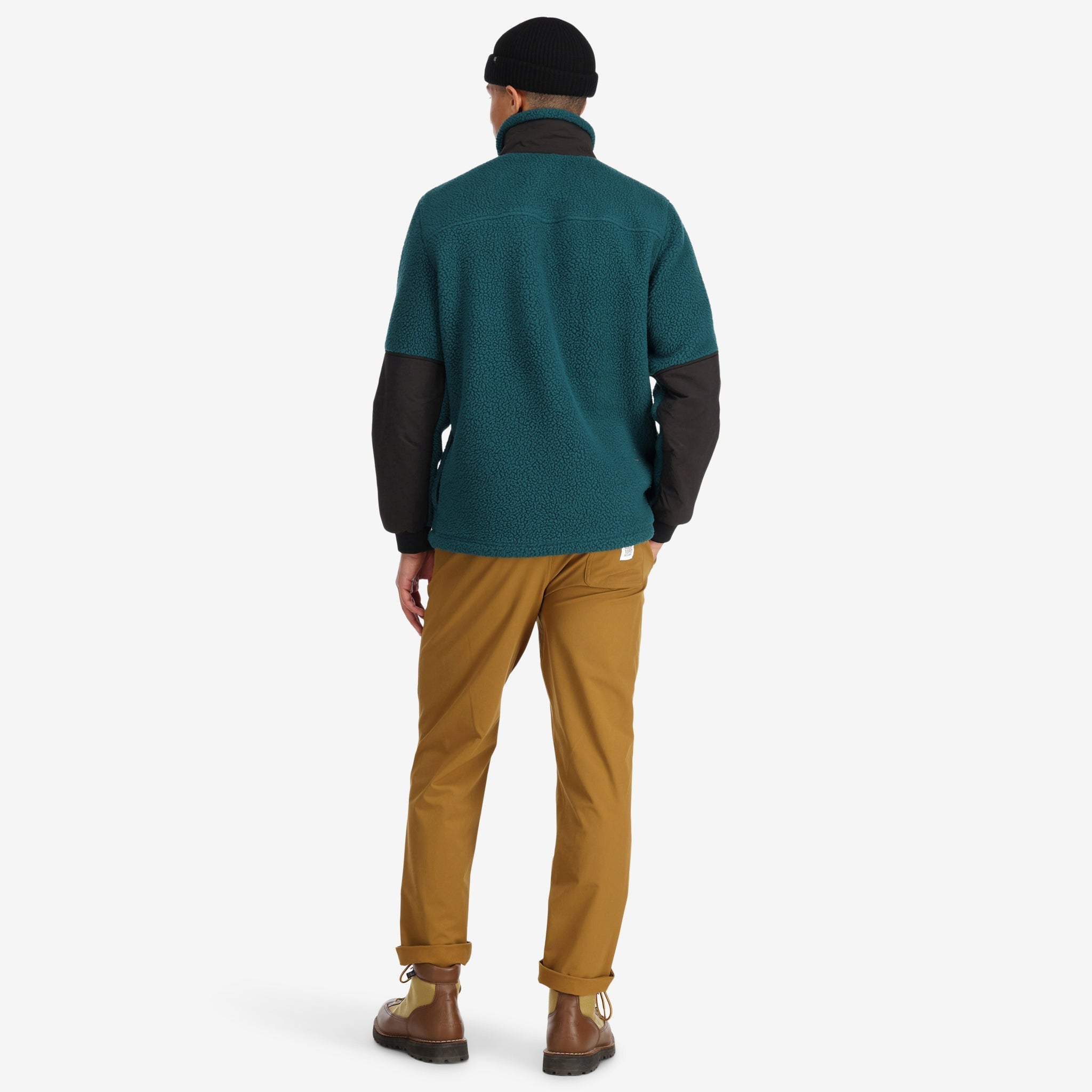 Back model shot of Topo Designs Men's Mountain Fleece Pullover in "Pond Blue". Show on "Black" & "Slate Blue / Blue"