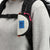 General model shot of Topo Designs Taco Bag carabiner key clip keychain bag in "Bone White" nylon.