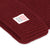 General detail shot of logo patch on Topo Designs Watch Cap cuffed beanie in "burgundy" red.