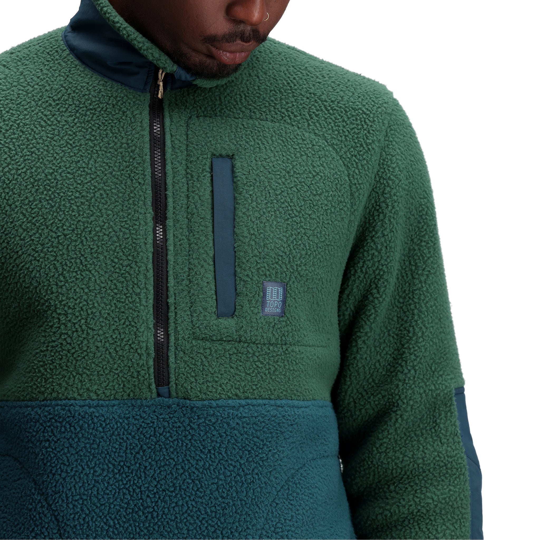 General shot of M Mountain Fleece Pullover in "Forest / Pond Blue"