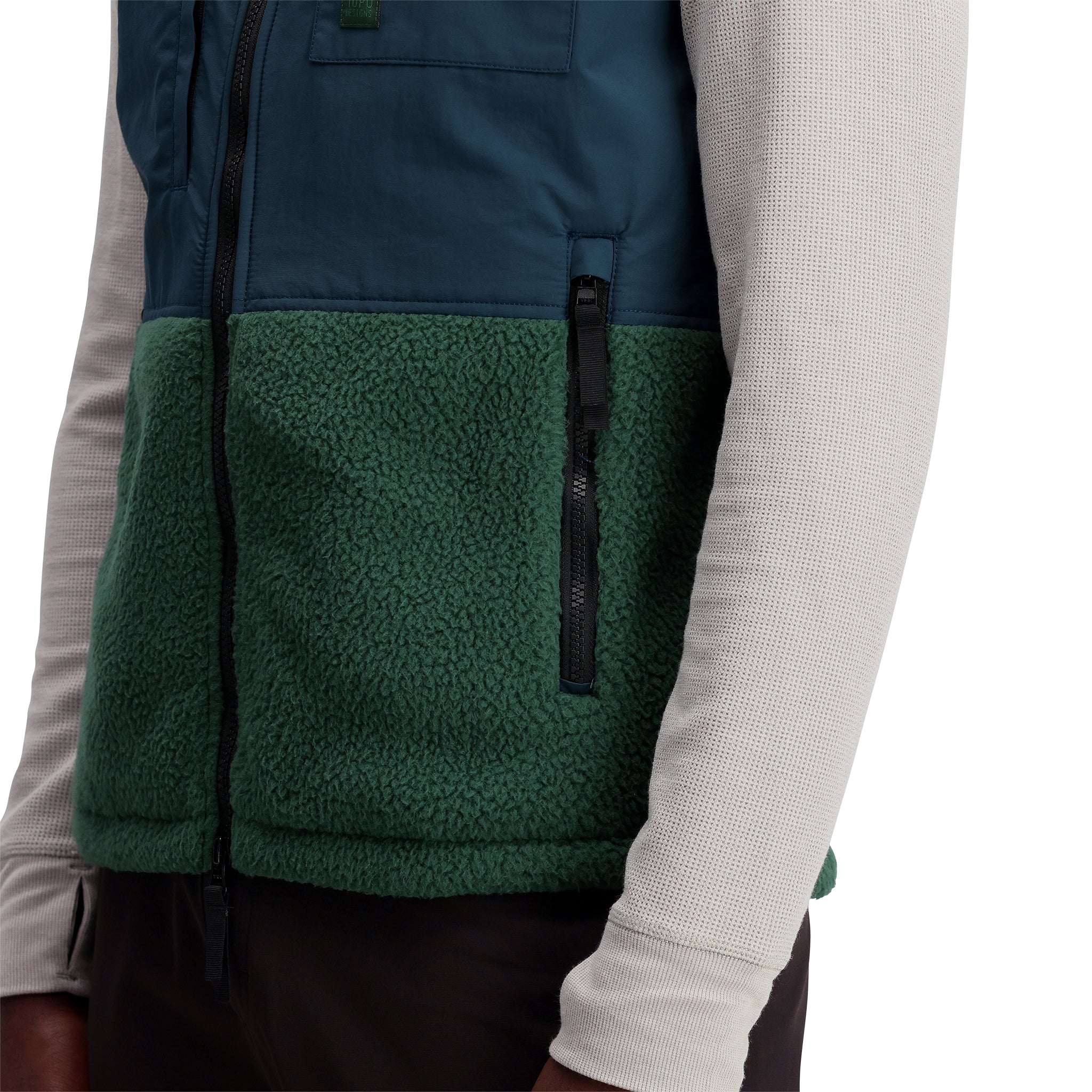 General shot of Subalpine fleece vest in "Forest / Pond Blue"