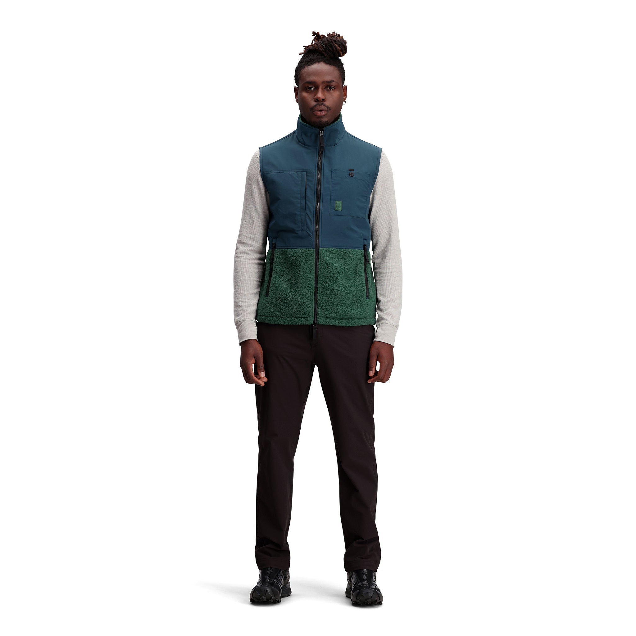 General shot of Subalpine fleece vest in "Forest / Pond Blue"