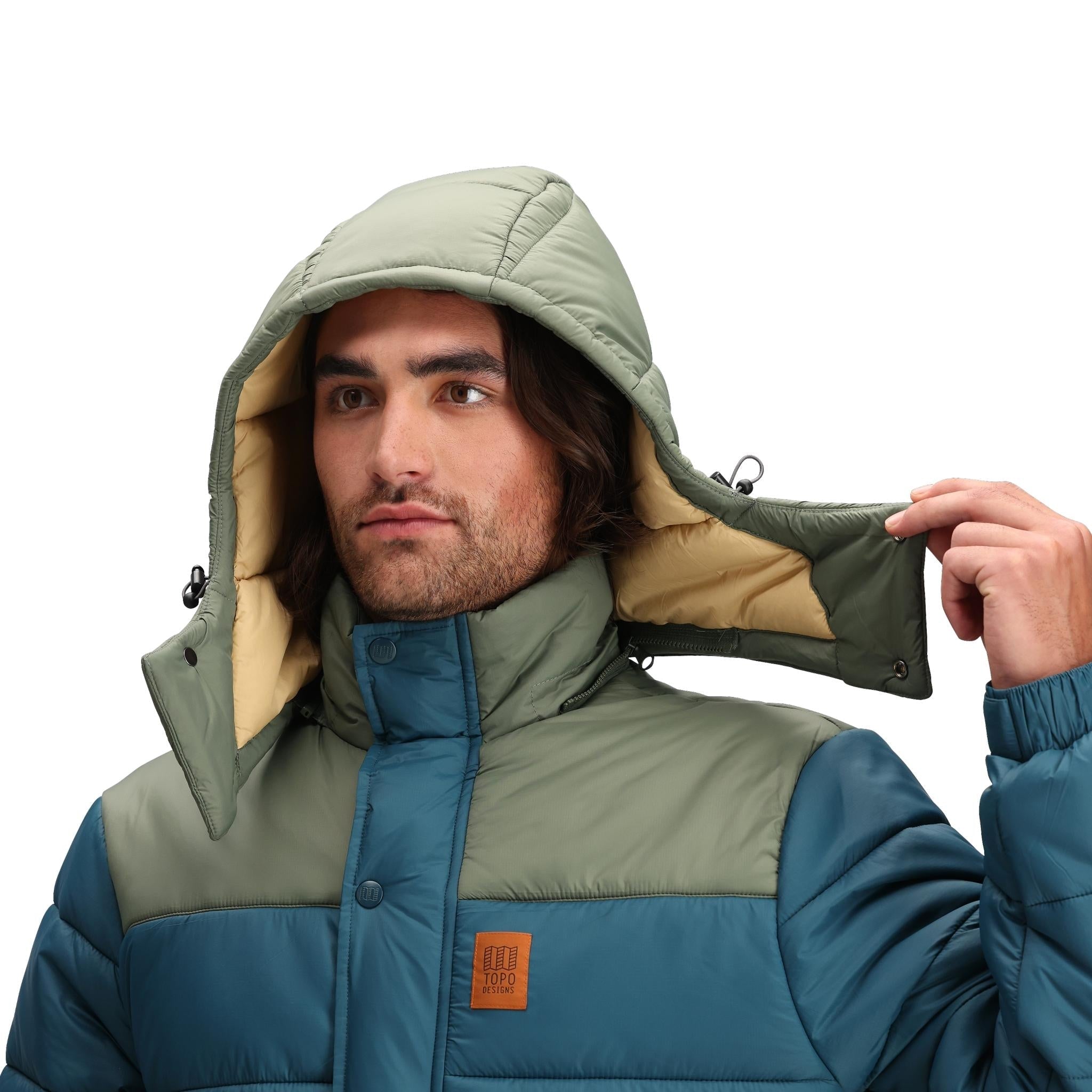 Detail shot of Topo Designs Retro Ridge Puffer Jacket - Men's  in "Pond Blue / Beetle"