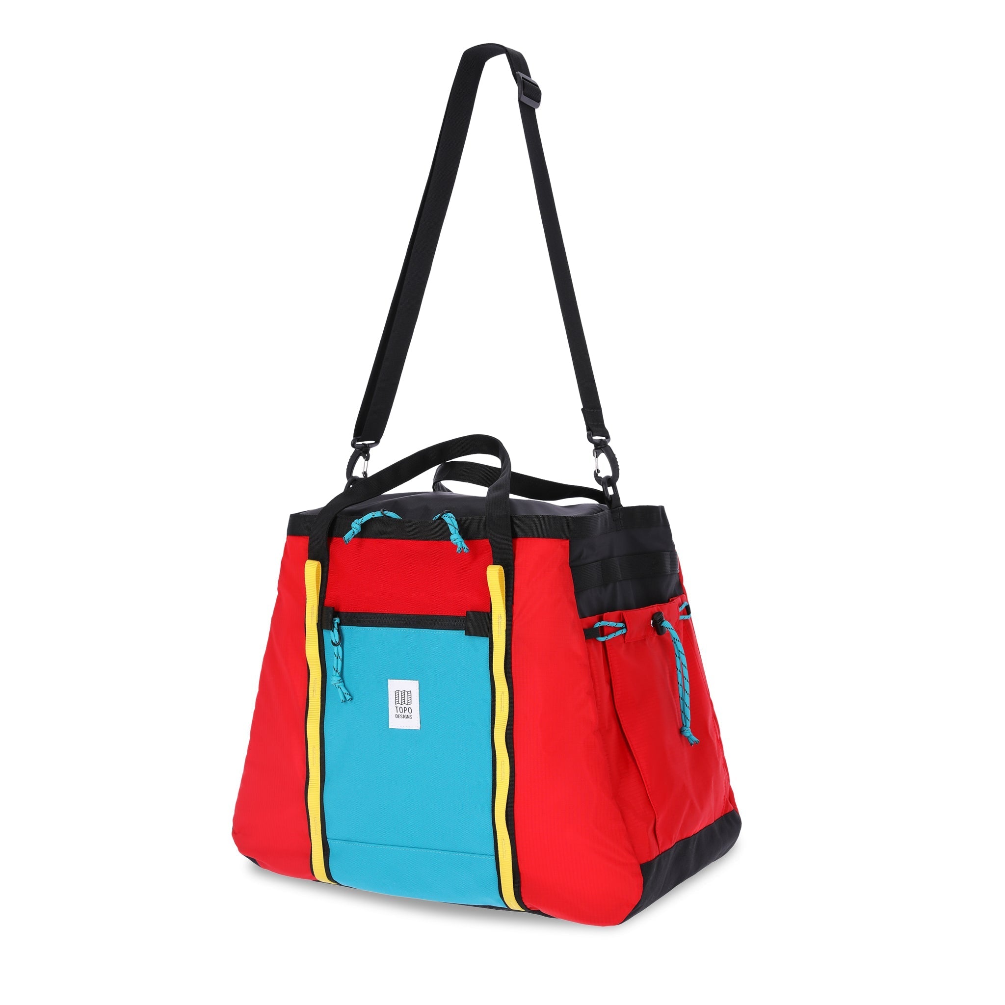 Shoulder carry strap on Topo Designs Mountain Gear Bag tote hauler in lightweight recycled red turquoise blue nylon.