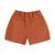 Back pockets on Topo Designs Women's drawstring Dirt Shorts in 100% organic cotton in "Brick" orange.