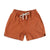 Topo Designs Women's drawstring Dirt Shorts in 100% organic cotton "Brick" orange.