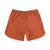 Back zipper pocket on Topo Designs Women's River quick-dry swim Shorts in "Brick" orange.