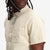 Topo Designs Men's Short Sleeve Dirt Shirt in "Sand" white natural closeup.