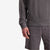 General right arm cuff, model shot of Topo Designs Men's Dirt Crew sweatshirt in 100% organic cotton in "charcoal" grey.