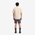 On model back shot of Topo Designs Men's drawstring Dirt Shorts 100% organic cotton in "Charcoal" gray.