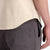 General on model back pocket shot of Topo Designs Men's drawstring Dirt Shorts 100% organic cotton in "Charcoal" gray.