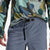 General on model photo of the front of Topo Designs Men's River quick-dry swim Shorts in "Stone Blue" blue.