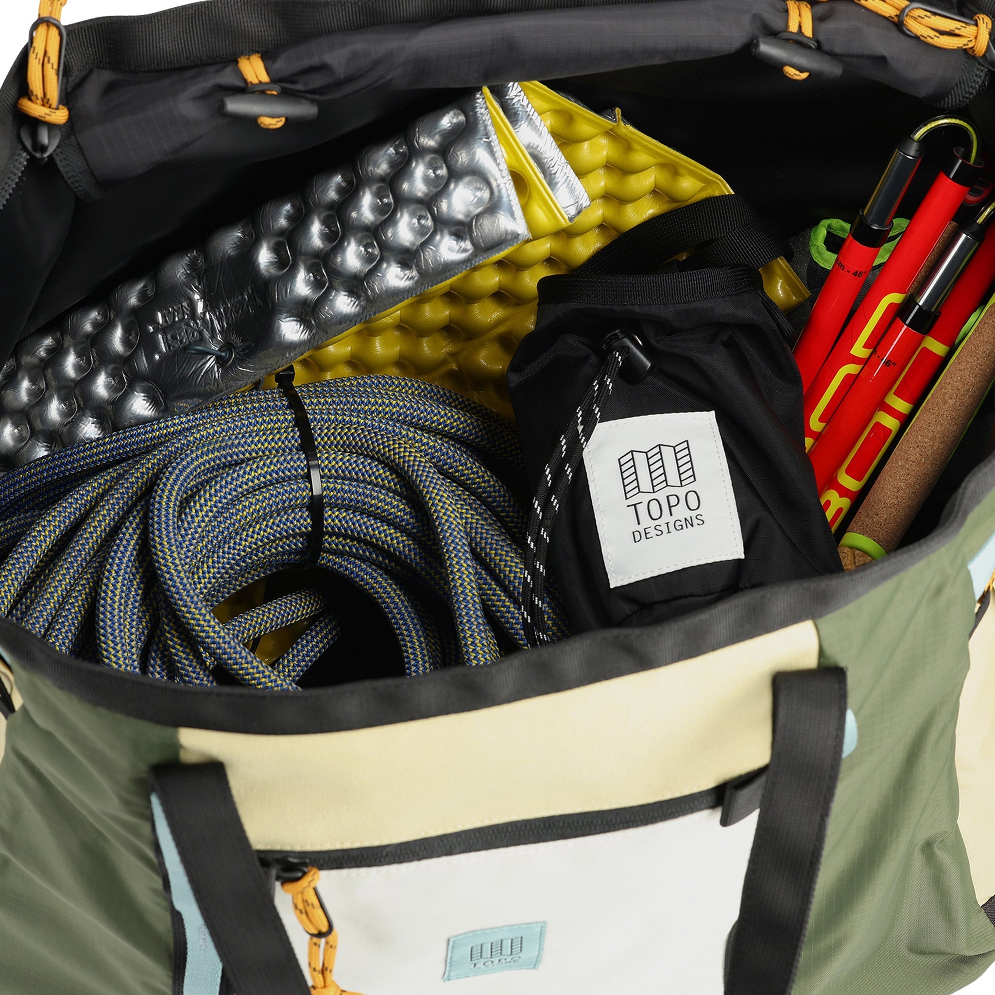 General shot of interior of Topo Designs Mountain Gear Bag tote hauler in lightweight recycled "Bone White / Olive" nylon.