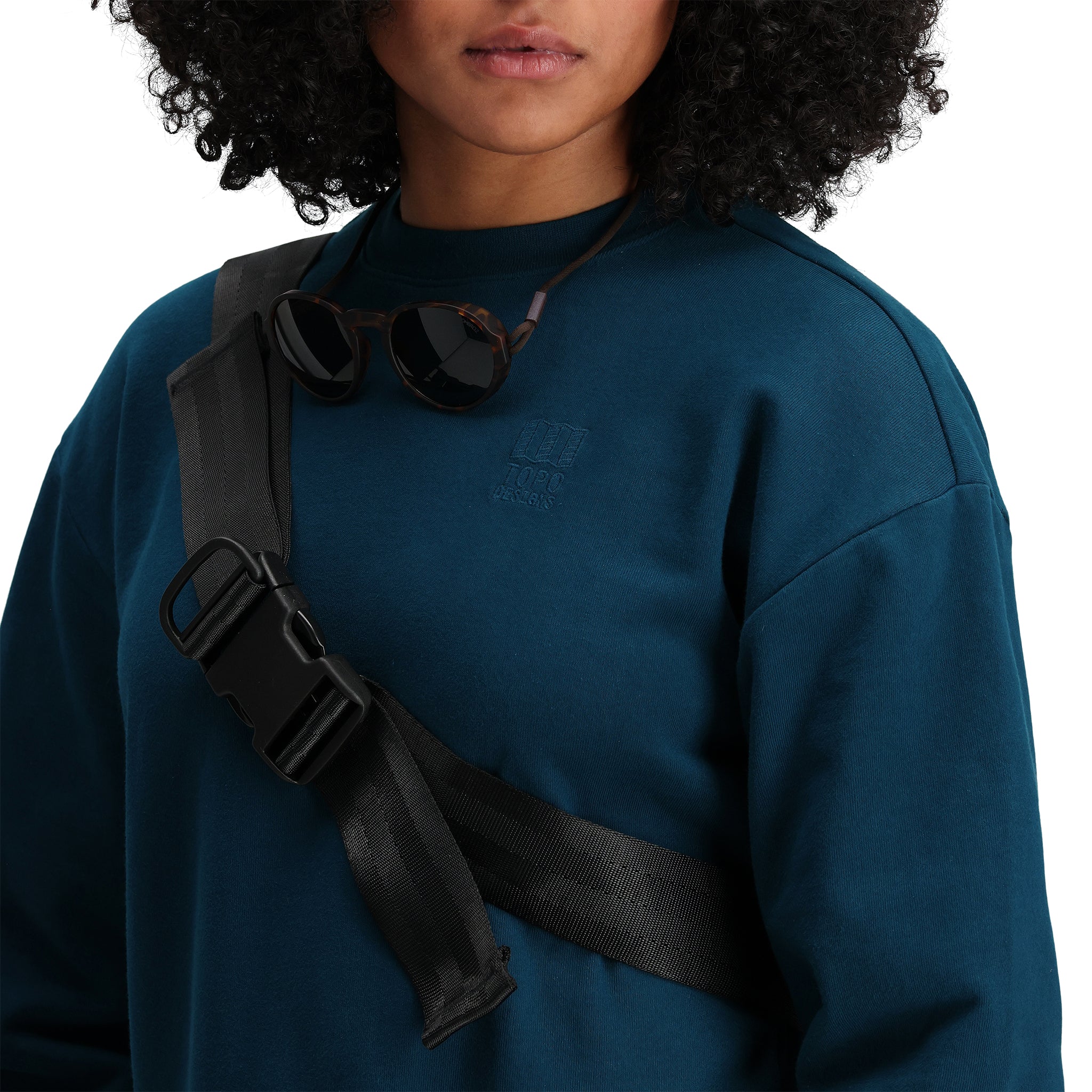 General detail shot of Topo Designs Women's Dirt Crew sweatshirt in 100% organic cotton French terry in "Pond Blue".