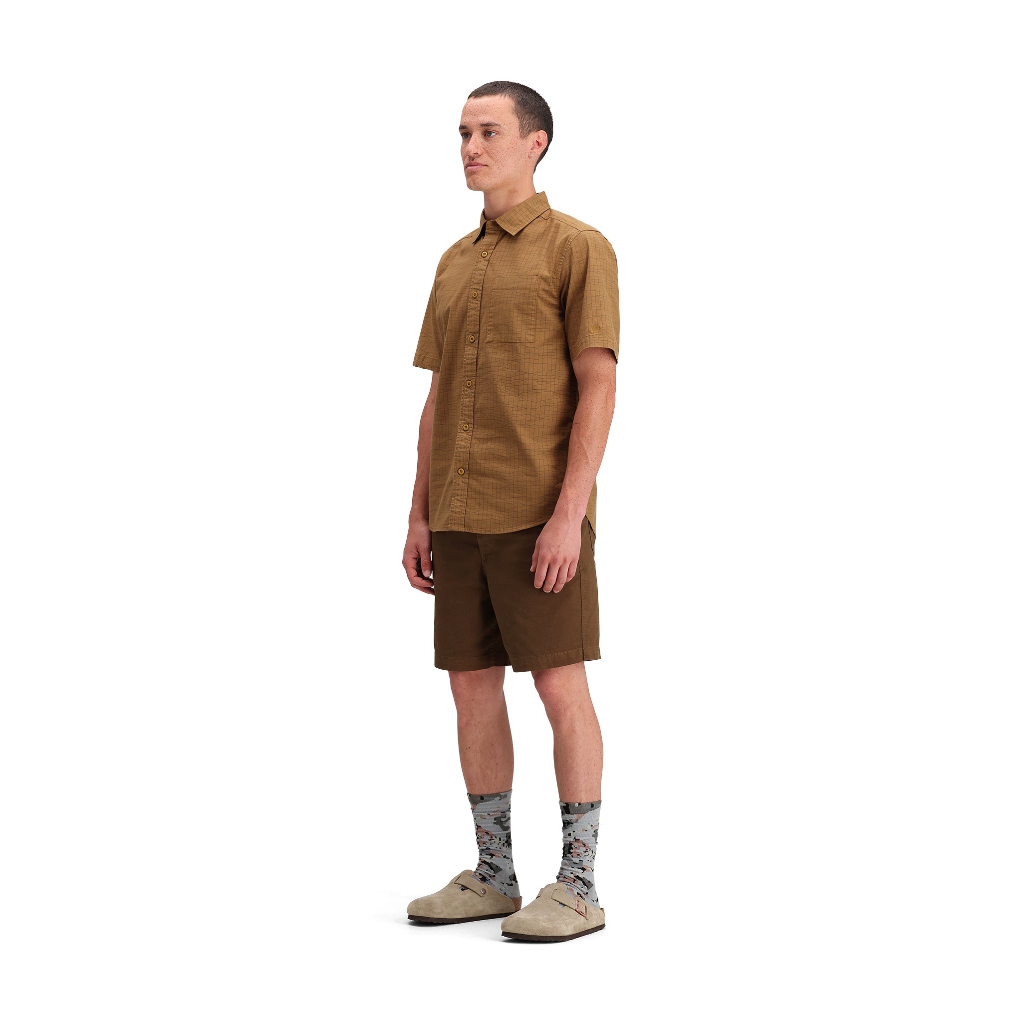 General side model shot of Topo Designs Dirt Desert Shirt Ss - Men's  in "Dark Khaki Terrain"