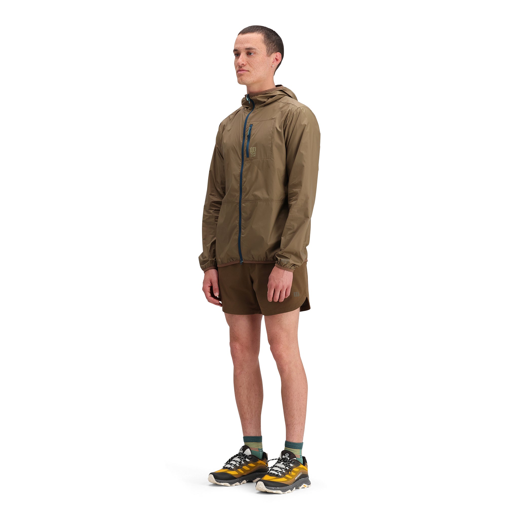 General side model shot of Topo Designs Global Ultralight Packable Jacket - Men's in "Desert Palm"