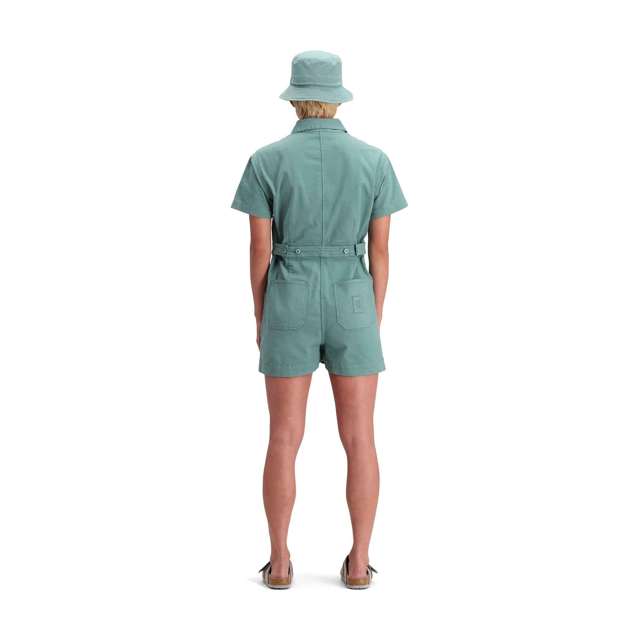General back model shot of Topo Designs Dirt Romper - Women's in "Sea Pine"