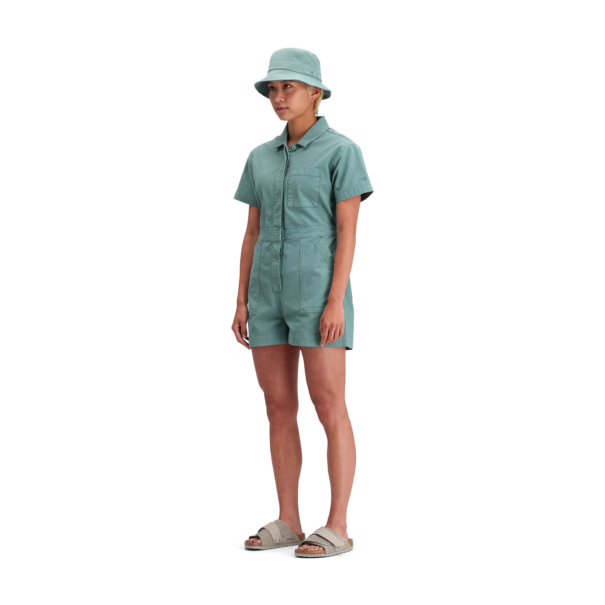 General side model shot of Topo Designs Dirt Romper - Women's in "Sea Pine"