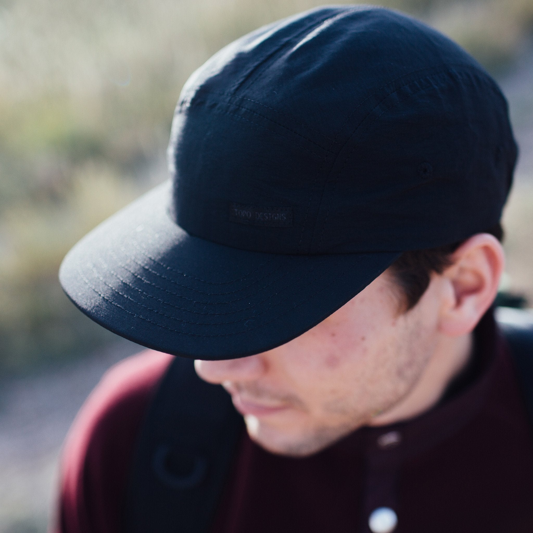 Lifestyle shot of the Nylon Camp Hat in black