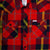 Front detail shot of Topo Designs men's mountain shirt plaid in "red multi" plaid showing inside tags, buttons, and chest pockets.
