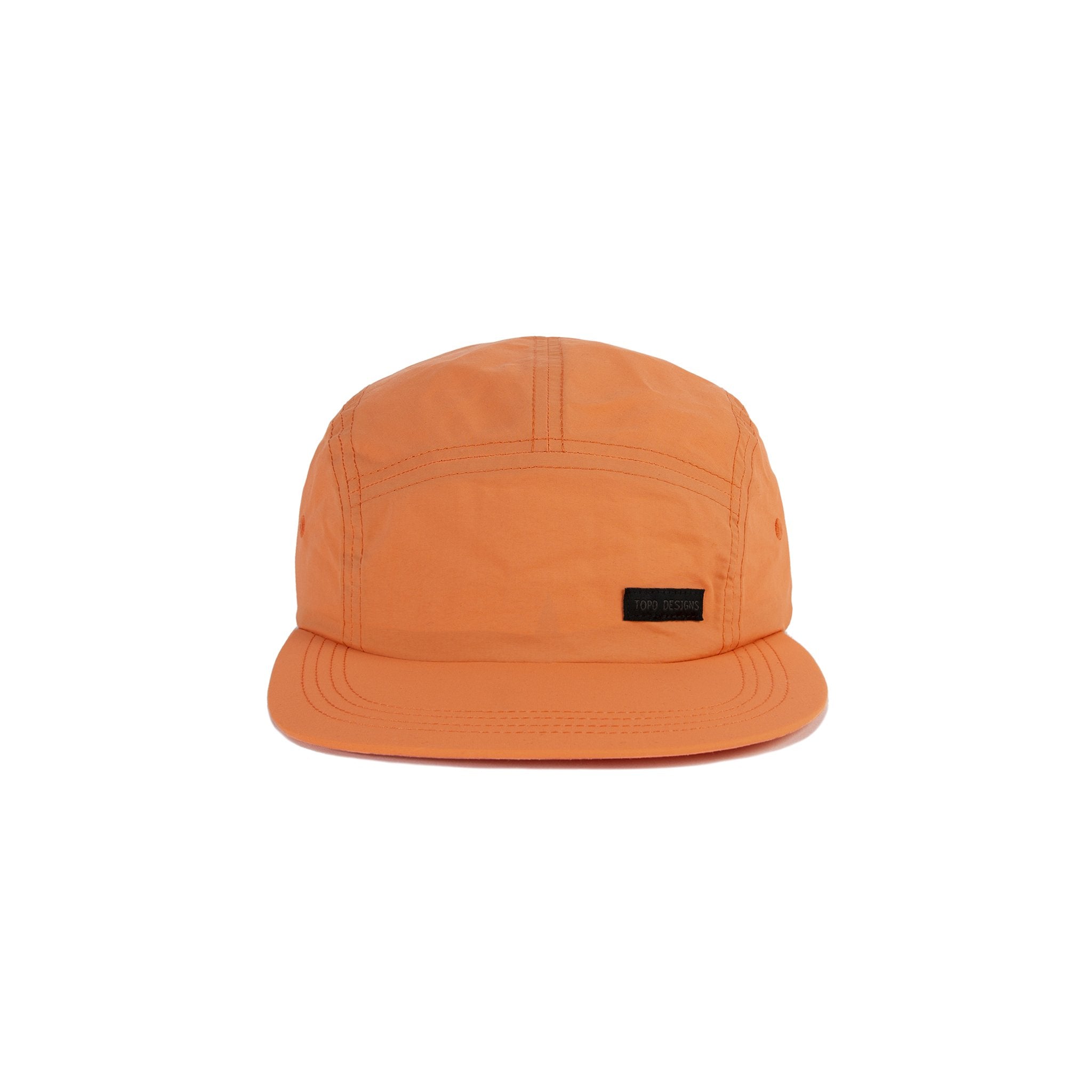 Topo Designs Nylon Camp 5-panel flat brim Hat in Rust pink orange.