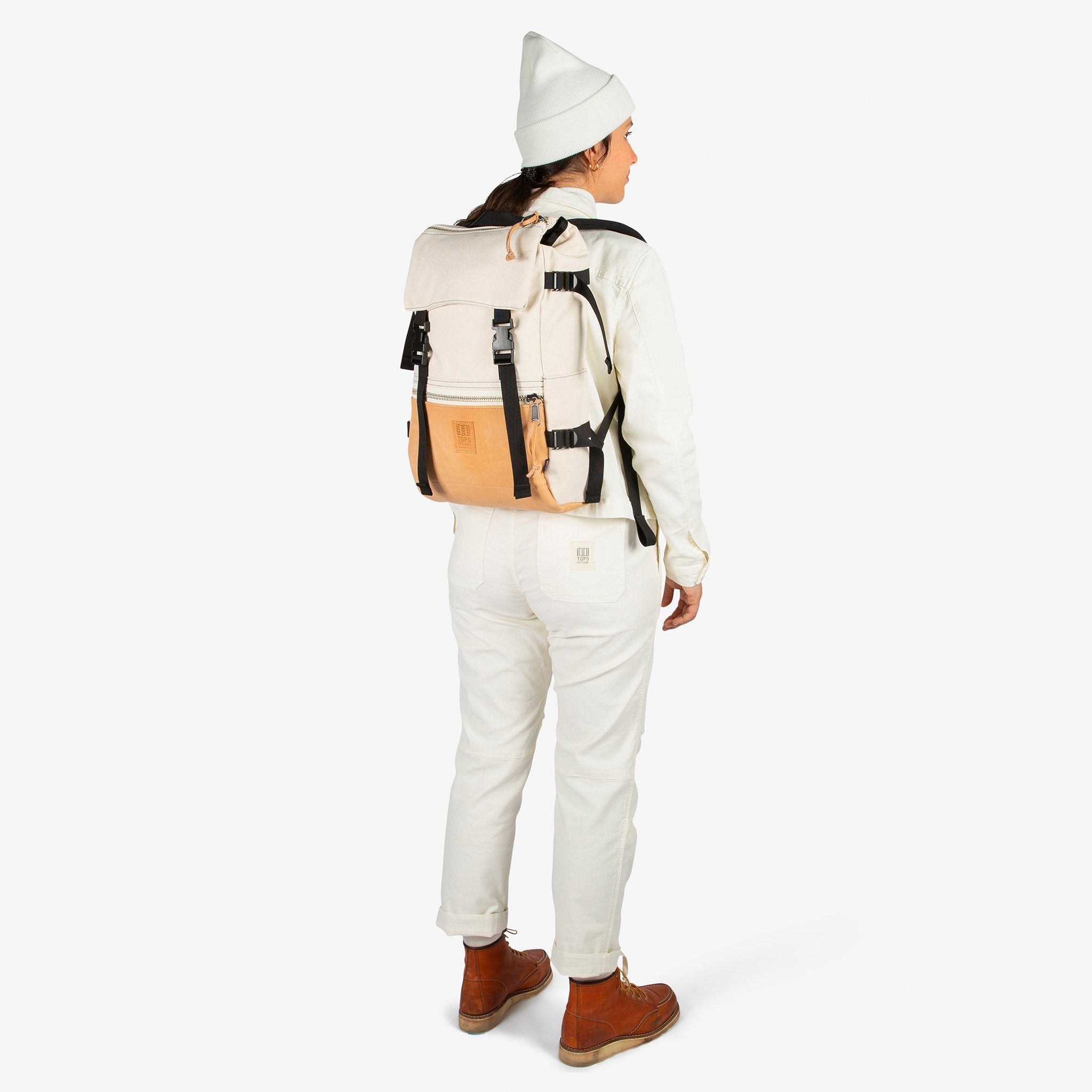 Back model shot of Topo Designs Women's Dirt Jacket & Pants in Natural white.