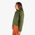 Side model shot of Topo Designs Women's Dirt Jacket in "Olive" green & Dirt Pants in Brick orange.
