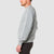 Side model shot of men's global sweater in gray