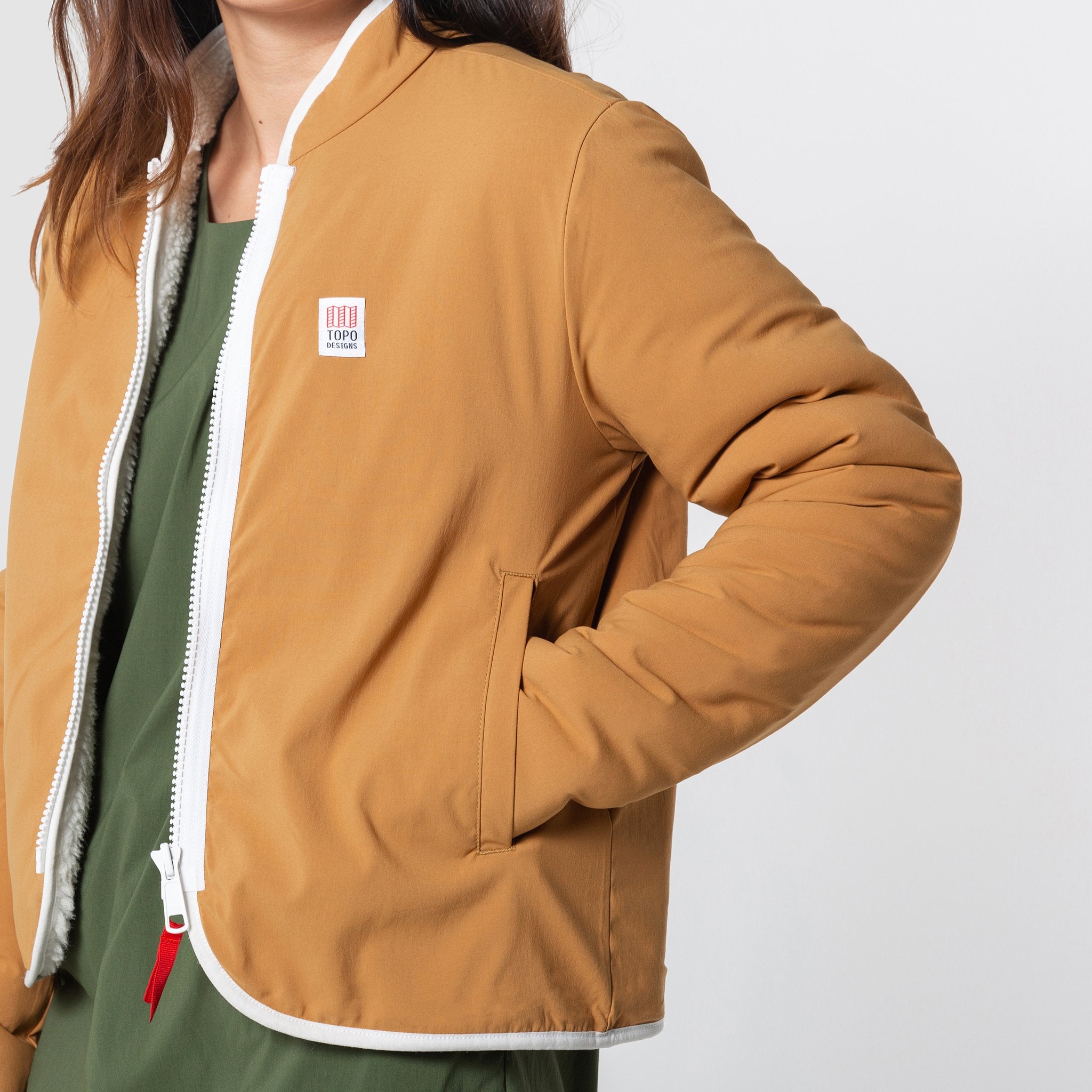 General front model shot of the sherpa jacket in "natural / khaki" showing the DWR tech fabric unzipped