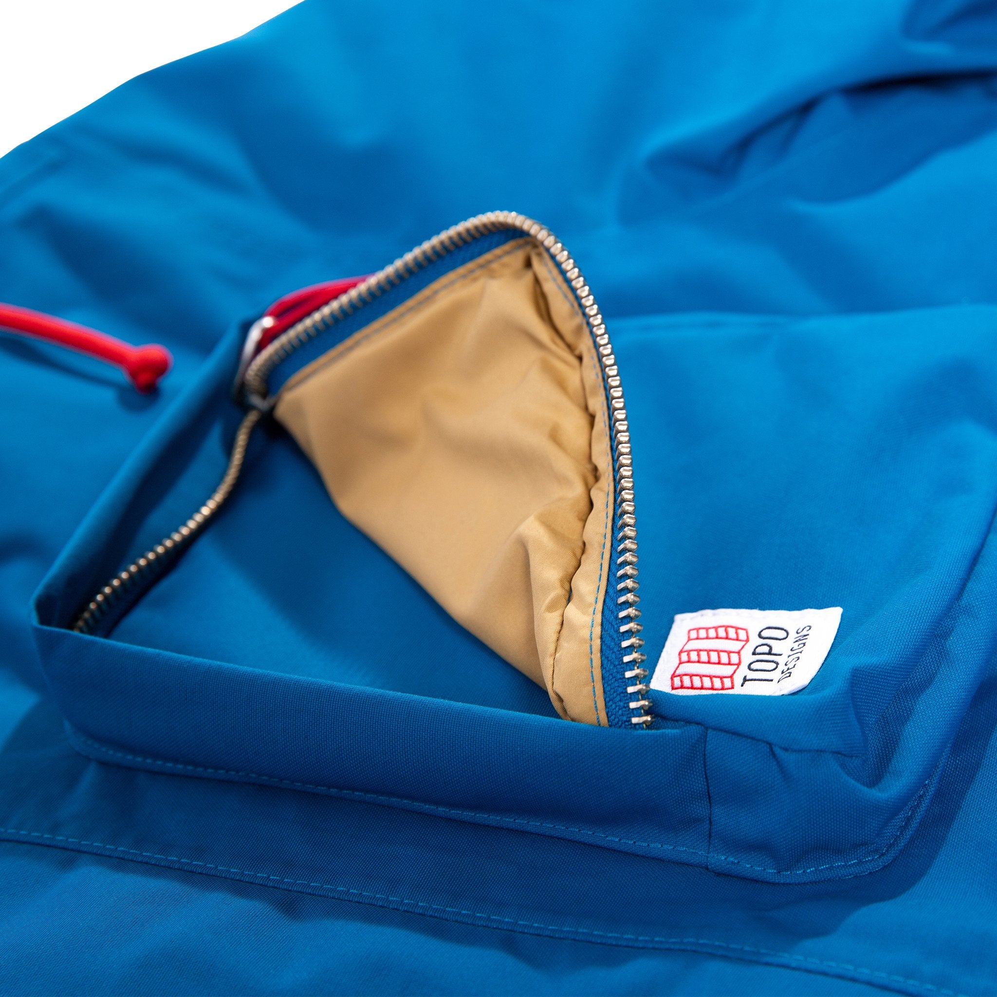 Product shot of men's mountain jacket showing zipper front dimensional top pockets