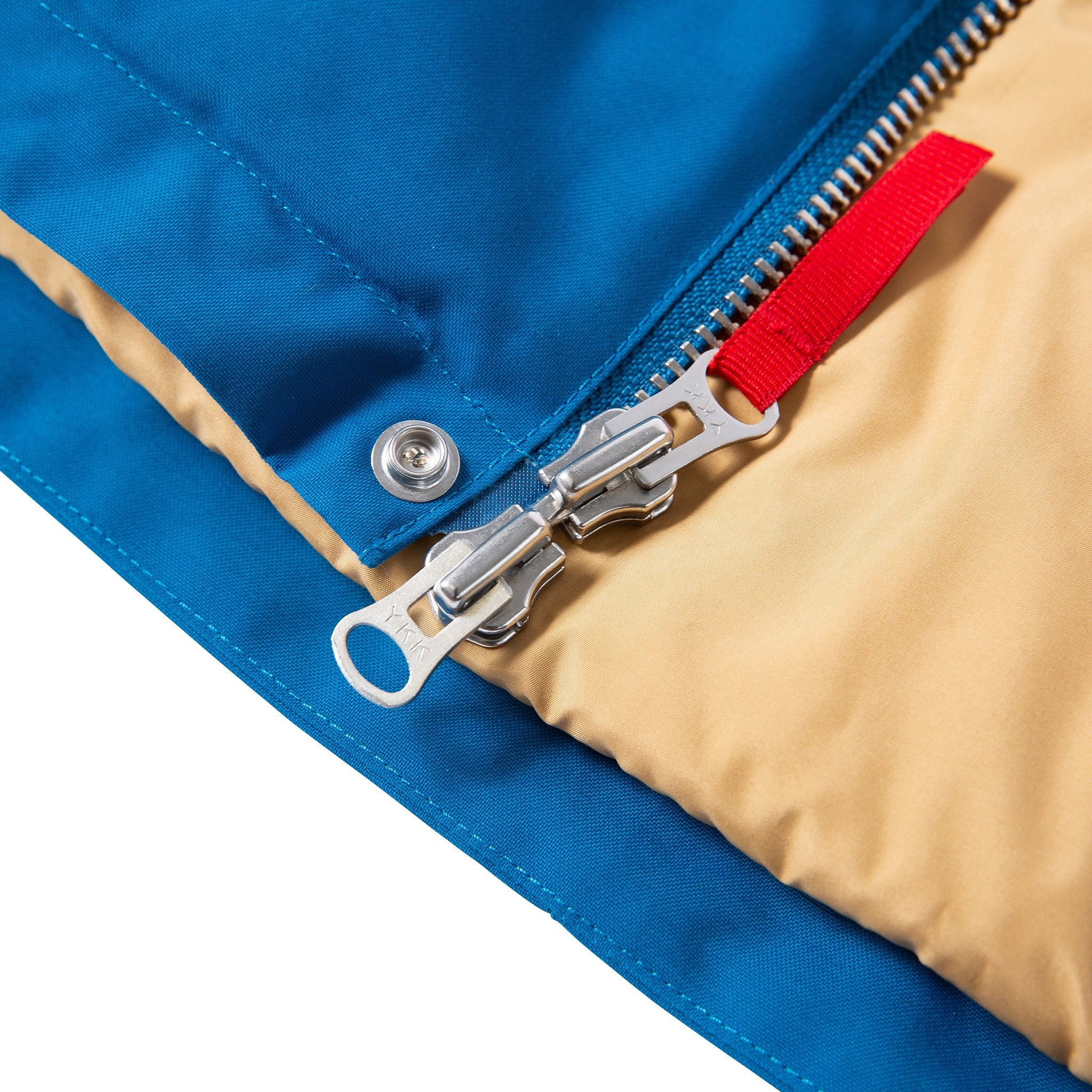 Product shot of men's mountain jacket in blue showing waterproof taped seams