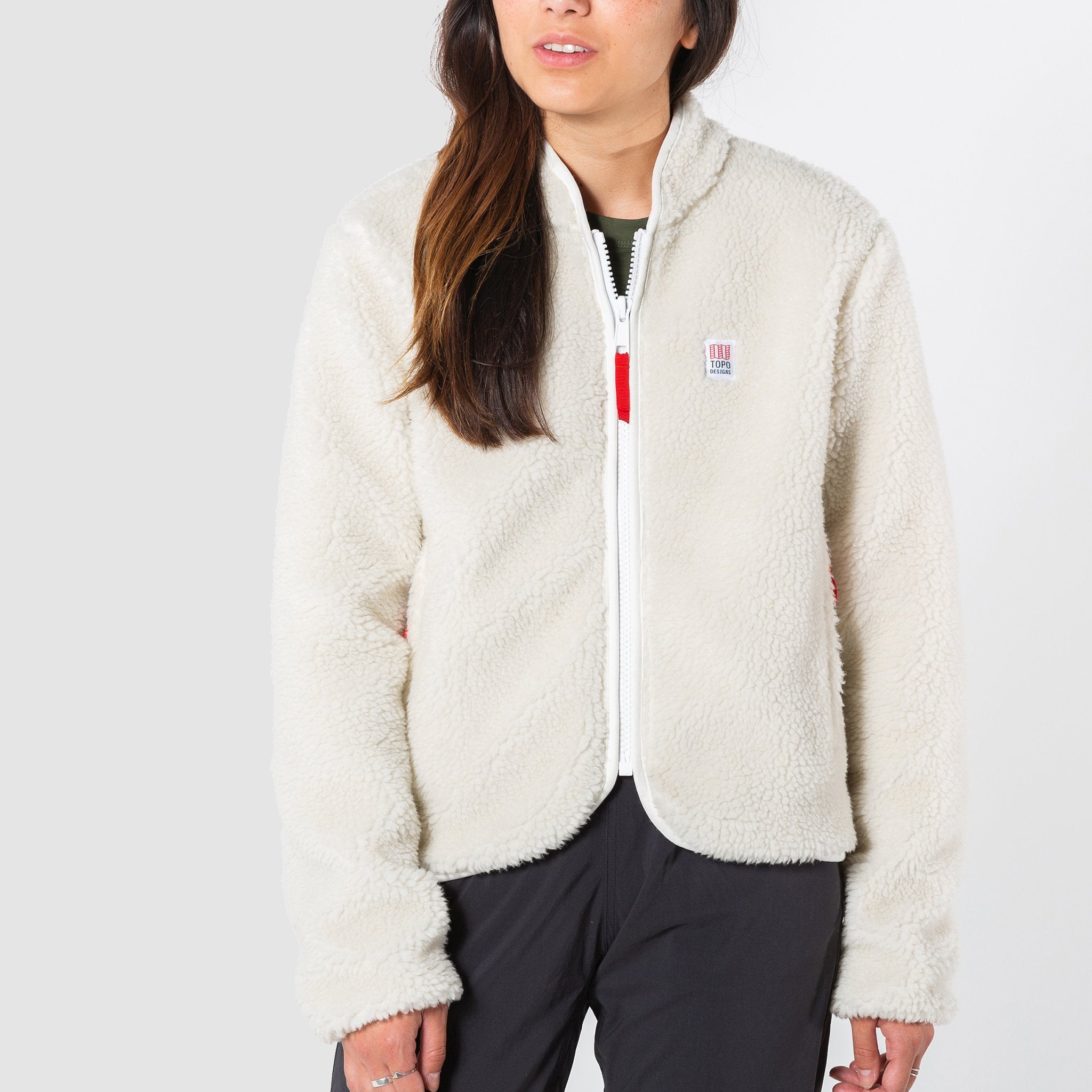 Front model shot of the sherpa jacket in "natural / khaki" showing the sherpa fleece zipped