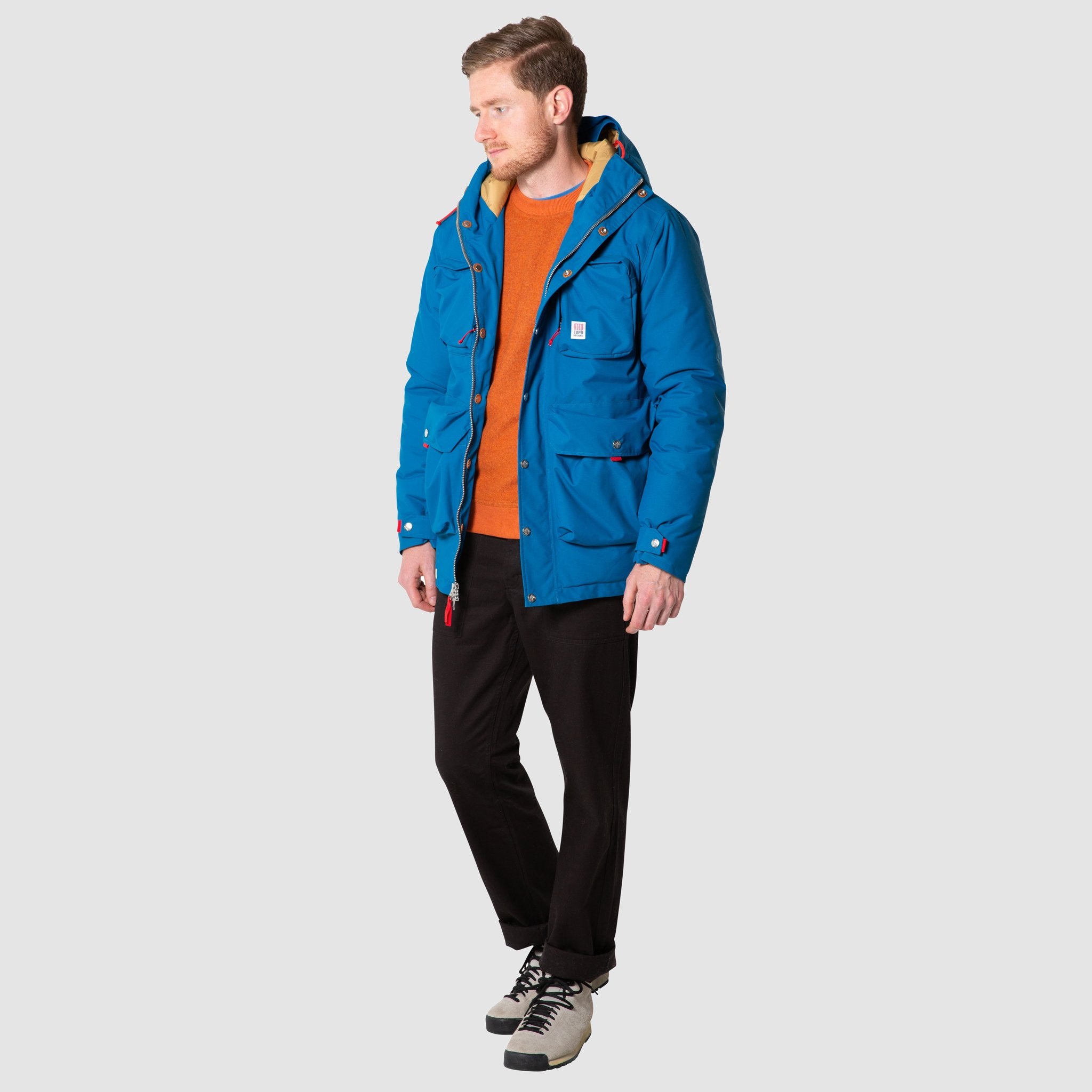 Full body front model shot of men's mountain jacket in blue, unzipped