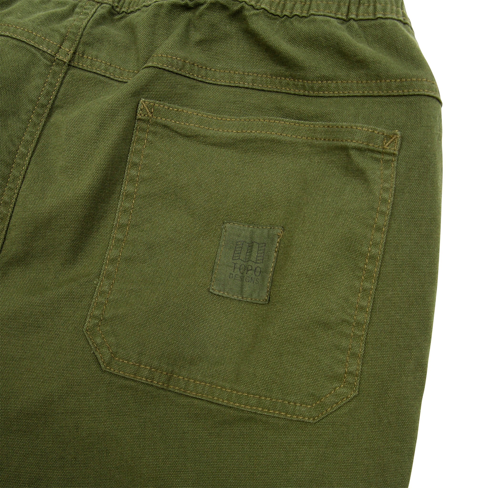 General detail shot of Topo Designs Men's Dirt Pants in Olive green showing back pockets.