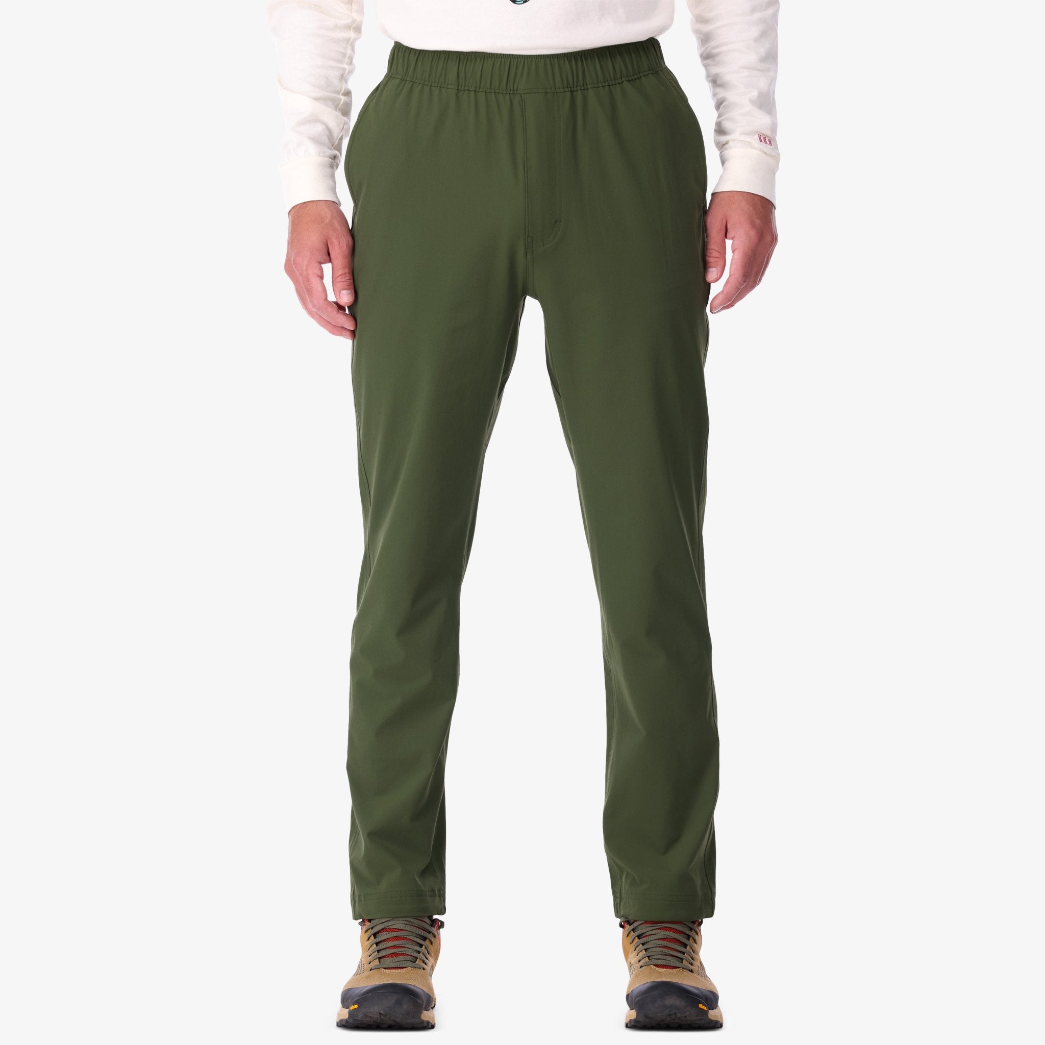 Shot of Topo Designs Men's Boulder lightweight climbing & hiking pants in "Olive" green on model.