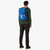 Topo Designs Rover Pack laptop rucksack in blue canvas on model's back.
