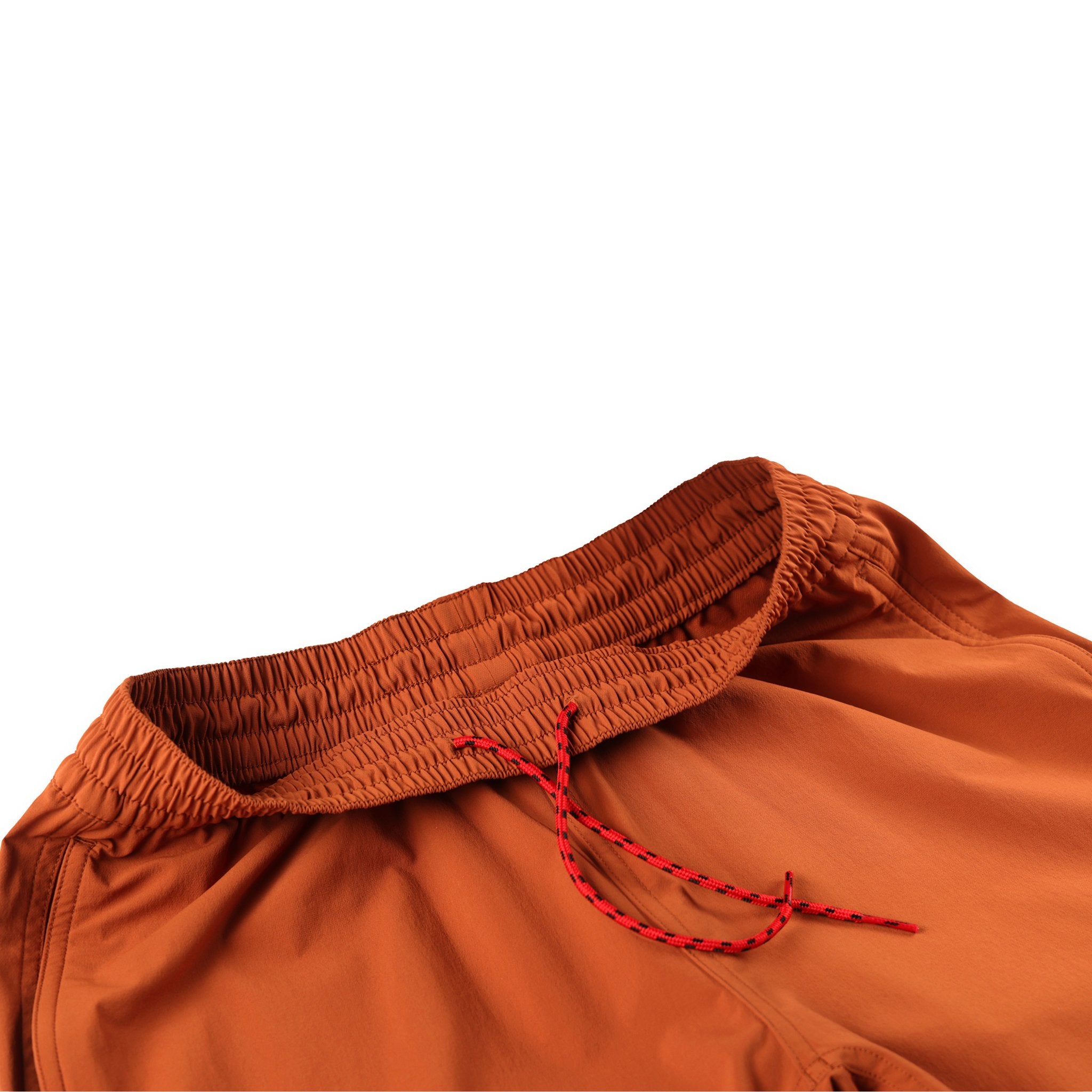 Topo Designs women's boulder pants in brick orange detail of drawstring on elastic waist.