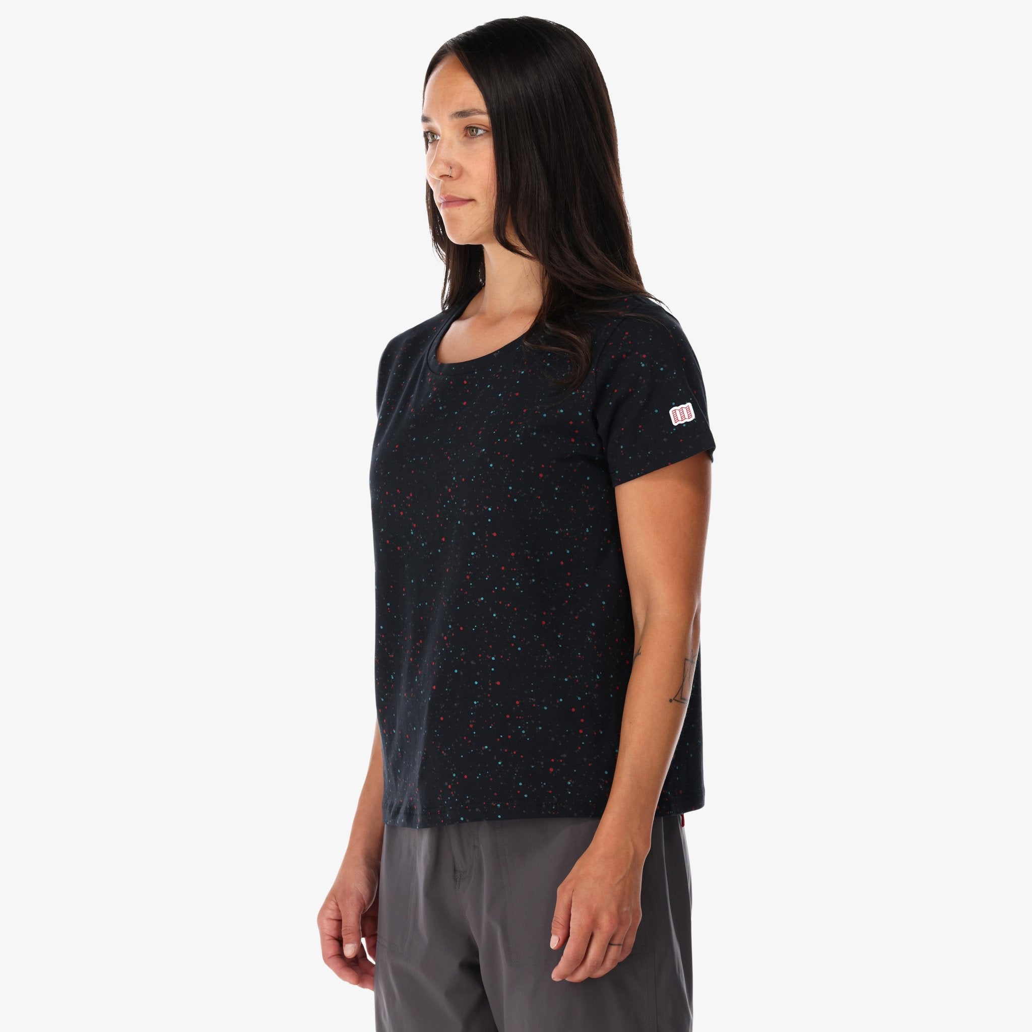 General side shot of Topo Designs Women's organic cotton Cosmos t-shirt in black on model.