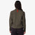 Back model shot of Topo Designs Women's Global long sleeve lightweight snap travel shirt in "olive" green on model front.