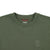 General detail shot of neckline, chest logo, & internal hang loop on Topo Designs Men's Dirt Crew sweatshirt in 100% organic cotton in olive green.