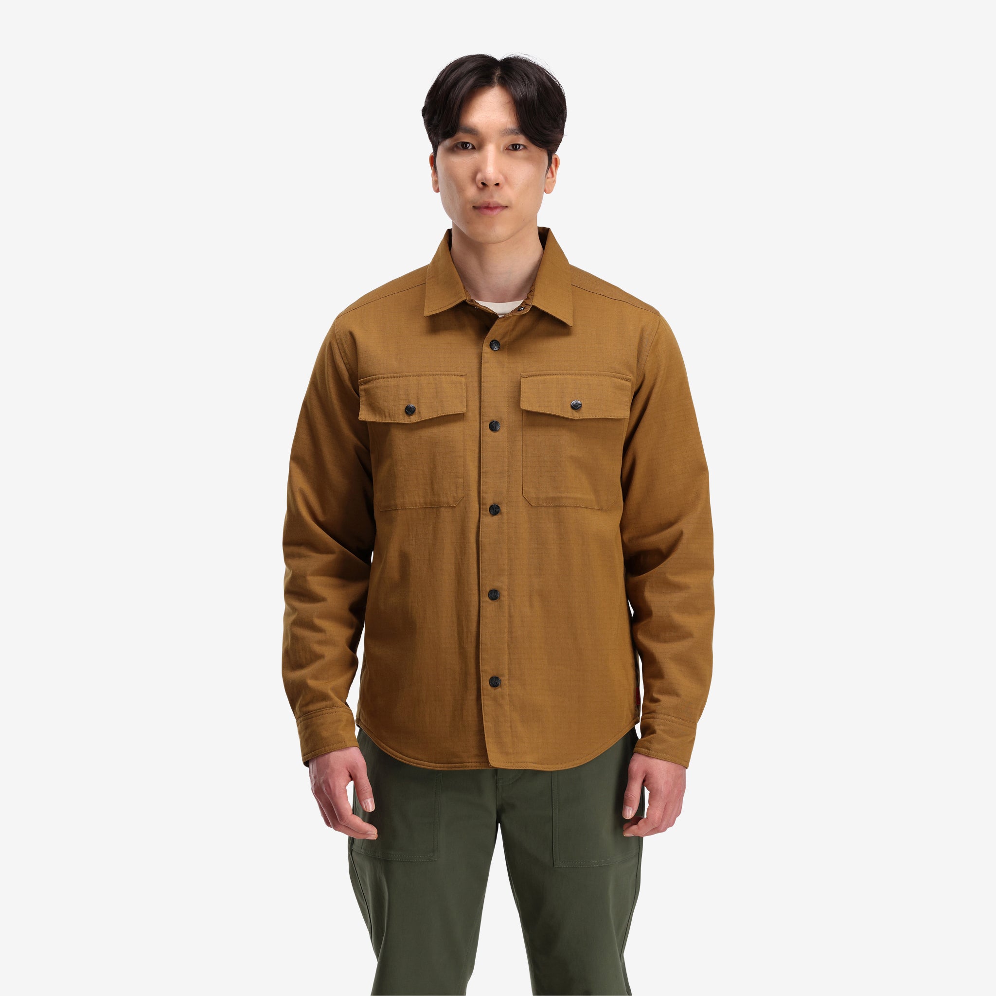 Front model shot of Topo Designs Men's Insulated Reversible Shirt Jacket in "dark khaki" brown