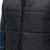 General front detail shot of Topo Designs Men's Mountain Puffer recycled insulated Vest in "Black" showing double zipper