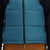 Front model shot of Topo Designs Men's Mountain Puffer recycled insulated Vest in "Pond Blue" showing zipper hand pockets.