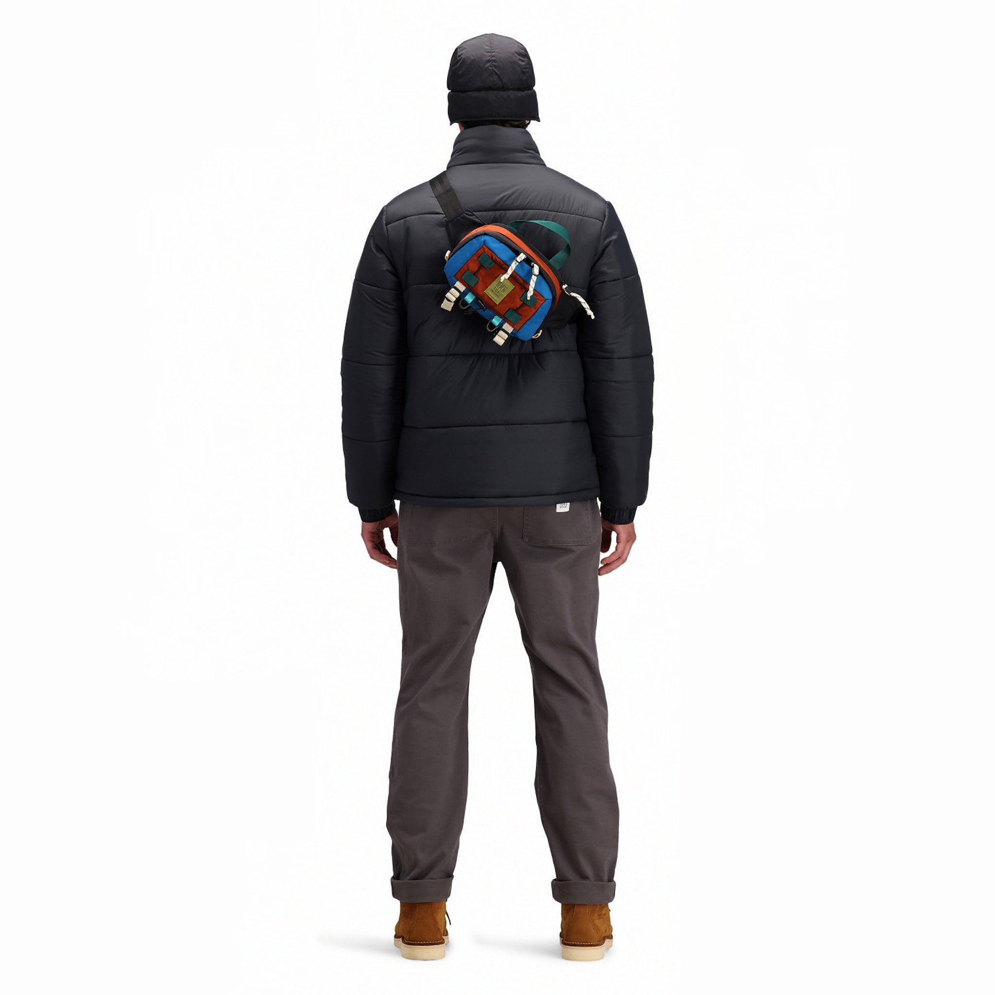 Back model shot of Topo Designs Men's Puffer recycled insulated Jacket in "Black"