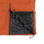 General detail shot of zipper and interior baffles on Topo Designs Mountain Puffer Primaloft insulated Hoodie jacket in "Brick" orange
