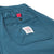 General detail shot of back snap pocket on Topo Designs women's boulder lightweight hiking and climbing pants in "pond blue"